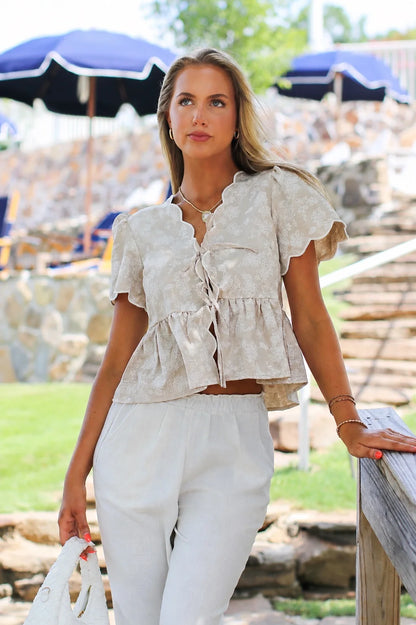 The Bloom Tie Embroidered Scalloped Peplum Top